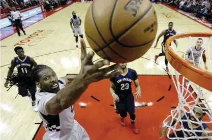  ?? —AP ?? HOUSTON: Houston Rockets’ Nene Hilario (42) goes up to shoot against the New Orleans Pelicans during the first half of an NBA basketball game Friday, in Houston.