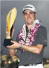  ?? PHOTO: GETTY IMAGES ?? American Justin Thomas celebrates with the trophy after wining the Sony Open in Honolulu by seven shots yesterday.