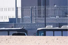  ?? JAMES QUIGG/THE DAILY PRESS ?? Homeland Security buses enter the Federal Correction­al facility in Victorvill­e, Calif., on Friday. More than 1,600 people arrested at the U.S.-Mexico border, including parents who have been separated from their children, are being transferre­d to...