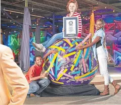  ?? Pictures: PA. ?? Clockwise from top left: Freddy, the tallest dog, with his owner Clare Stoneman, Arcturus the tallest cat with owners William and Lauren Powers and the world’s largest tape ball. Left: Benny Harlem who has the tallest high top fade