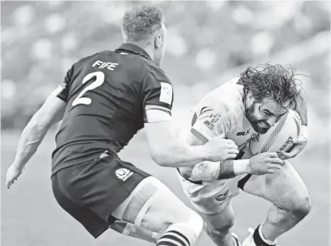  ?? SUHAIMI ABDULLAH, GETTY IMAGES ?? The Patriots’ Nate Ebner, right, playing for the U.S. sevens team in April, played rugby long before he took up football.