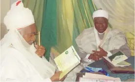  ??  ?? Isyaku Umar Tofa, Dan Adalan Kano, and Bashir Dalhatu, going through the programme of the conference