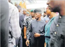  ?? Picture: REUTERS/FILE ?? Nigeria’s Vice-President Yemi Osinbajo speaks with youths as he prepares to leave the venue of the launch of Google free wifi project in Lagos, Nigeria.