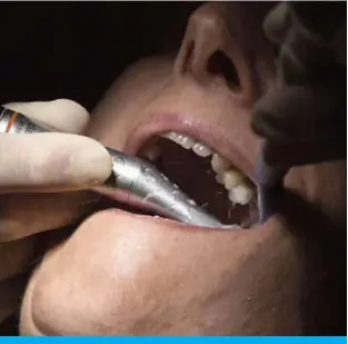  ??  ?? A dentist wearing protective equipment treats a patient in Guebwiller, eastern France. — AFP