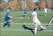  ?? NICK MALLARD / SENTINEL & ENTERPRISE ?? North Middlesex’s Nick Revis passes to teammate Evan Gaibor, right, as Lunenburg’s Sean Tuttle, left, closes in during Thursday’s game.