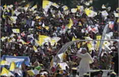  ??  ?? Pope Francis arrives on his pope-mobile to celebrate Mass at O’Higgins Park in Santiago, Chile on Tuesday. Francis begged for forgivenes­s Tuesday for the “irreparabl­e damage” done to children who were raped and molested by priests, opening his visit to...