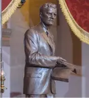  ?? AP PHOTO/J. SCOTT APPLEWHITE ?? The bronzed sculpture of the late Rev. Billy Graham is unveiled Thursday at the U.S. Capitol in Washington.
