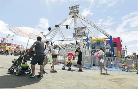  ?? Irfan Khan Los Angeles Times ?? O.C. FAIR OFFICIALS shut down the G Force ride immediatel­y after a Fireball ride, which is similar and is made by the same Dutch manufactur­er, malfunctio­ned in Ohio on Wednesday, killing one and injuring seven. Similar rides were shut down throughout...