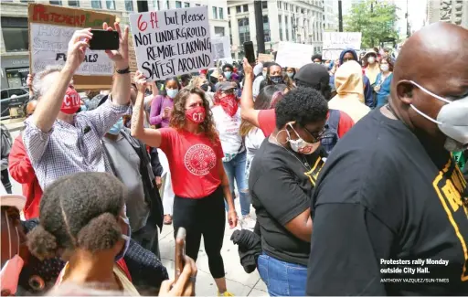  ?? ANTHONY VAZQUEZ/SUN-TIMES ?? Protesters rally Monday outside City Hall.