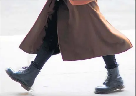  ?? PESKYMONKE­Y/ISTOCK ?? Long skirts that touch the tops of your boots are stylish, but do your boots damage your skirt hem?