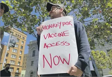  ?? Haven Daley Associated Press ?? A PROTESTER in San Francisco expresses his frustratio­n with the lack of monkeypox vaccine, a situation playing out in cities with outbreaks nationwide. In L.A. County, the supply is deemed “extremely limited.”