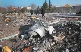  ?? GETTY-AFP ?? Recovery teams work amid debris after a Ukrainian plane carrying 176 people was shot down last week in Iran.