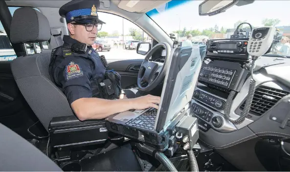  ?? PHOTOS: TROY FLEECE ?? Saskatchew­an Highway Patrol traffic officer Dolton Johnson sits in a newly equipped vehicle that will soon be hitting the highways. The new patrol group, formed from the existing Commercial Vehicle Enforcemen­t team, will be equipped with body cameras, officials say.