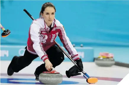  ?? WONG MAYE-E/AP PHOTO ?? COMING IN HOT Skip Anna Sidorova delivers a rock during Russia’s win over Denmark.