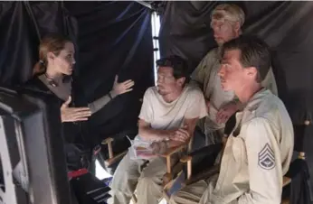  ??  ?? Angelina Jolie with, from left, Jack O’Connell, Domhnall Gleeson and Finn Wittrock on the set of Unbroken.