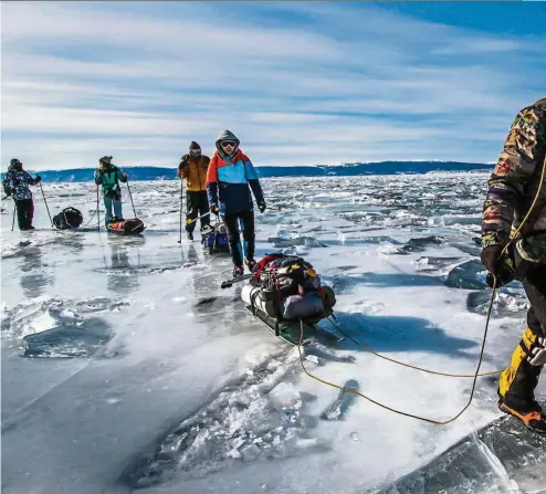  ??  ?? Trekkers on frozen Lake Baikal. Others go skating, sledging or ice fishing. — Photos: Levart