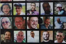  ?? — AFP photo by Ahmad Gharabli ?? Portraits of rescued Israeli-Argentinia­n hostages Louis Har (Top second right) and Fernando Simon Marman (bottom right) hang on a wall, along with pictures of other Israelis held captive in Gaza by Hamas, in central Jerusalem.