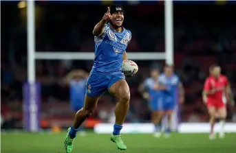  ?? GETTY IMAGES ?? Stephen Crichton celebrates a try for Samoa during their monumental upset Rugby League World Cup semifinal victory against England in London last weekend.