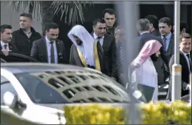  ?? AP ?? Saudi Arabia’s top prosecutor Saud al-Mojeb (center, left) leaves his hotel Tuesday to go to his country’s consulate in Istanbul.