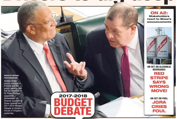  ?? RUDOLPH BROWN/ PHOTOGRAPH­ER ?? Audley Shaw (right), minister of finance and the public service, has the full attention of Dr Peter Phillips, opposition spokesman on finance, just before Shaw opened the 2017-2018 Budget Debate at Gordon House in Kingston, yesterday.