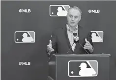  ?? AP Photo/John Raoux ?? ■ Rob Manfred, commission­er of Major League Baseball, speaks at a news conference during owners’ meetings Friday in Orlando, Fla.