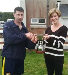  ??  ?? The Shield trophy was presented to Paul Culleton of Rosslare Rangers by Denise Dwyer, daughter of the late Richie Dwyer.