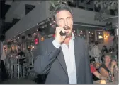  ?? ALAN DIAZ — THE ASSOCIATED PRESS FILE ?? Anti-virus software founder John McAfee talks on his mobile phone as he walks on Ocean Drive in the South Beach area of Miami Beach, Fla.