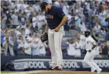  ?? ASSOCIATED PRESS ?? ANOTHER DOWNER: Eduardo Rodriguez reacts after giving up a first inning grand slam to the Yankees’ Gleyber Torres (background), which was enough to hand the Red Sox their fifth straight loss, 4-2, last night in New York.