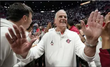  ?? Gregory Bull The Associated Press ?? San Diego State coach Brian Dutcher has the Aztecs in the Sweet 16 for just the third time in school history. They face No. 1 overall seed Alabama on Friday.