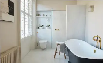  ??  ?? BATHROOM
The walk-in shower and flooring in Carrara marble, a Catchpole & Rye bath, Duravit WC and unpolished brass Vola fittings were all inspired by Ett Hem