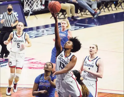  ?? David Butler II / Associated Press ?? UConn’s Christyn Williams (13) scores against DePaul on Tuesday in Storrs.