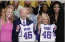  ?? EVAN VUCCI — THE ASSOCIATED PRESS ?? President Joe Biden and first lady Jill Biden are presented with jerseys by LSU women’s basketball team captains Angel Reese, right, and Emily Ward, left.