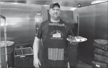  ?? STAFF PHOTO BY CAROL SMITH ?? Owner Robert Coulon brings Peruvian rotisserie chicken to Southern Maryland at Pollo Delicioso located in the Central Square Shopping Center in Prince Frederick.