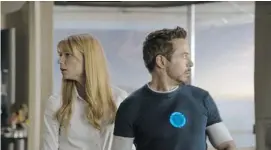  ?? Walt Disney Pictures/for the Calgary Herald ?? Gwyneth Paltrow, left, stars as Pepper Potts alongside Robert Downey Jr. in Iron Man 3. Previously panned, this outing has earned her more praise.