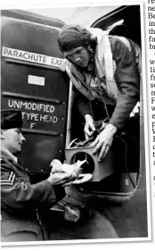  ??  ?? READY FOR TAKE-OFF: A pigeon is loaded on to an RAF plane bound for occupied Europe
