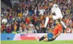  ??  ?? DAVID RAMOS/GETTY IMAGES Marcus Rashford (top) scores England’s second goal against Spain at Estadio Benito Villamarin in Seville, Spain, on October 15, 2018.