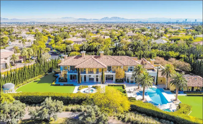  ?? The Ivan Sher Group/Berkshire Hathaway HomeServic­es Nevada Properties ?? Steve Wynn’s mansion in Las Vegas’ Summerlin community, seen in this photo provided to the Review-Journal in 2020, is under contract to sell.