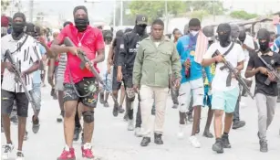  ?? ?? Jimmy Chérizier nicknamed Barbecue and his Gang members on the streets of Haiti