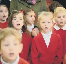  ??  ?? It’s beginning to look a lot like Christmas for these pupils in 2013 as they sang festive songs in The Bridges.