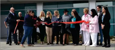  ?? ?? Angelica Sanchez, sister to fallen Fire Captain Ray Figueroa, cuts the red ribbon for the newest library junction honoring her brother and Firefighte­r Patrick Jones on Friday morning in front of Sierra View Medical Center.