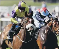  ??  ?? Brando, left, ridden by jockey Tom Eaves wins the Connaught Stakes at Newmarket.