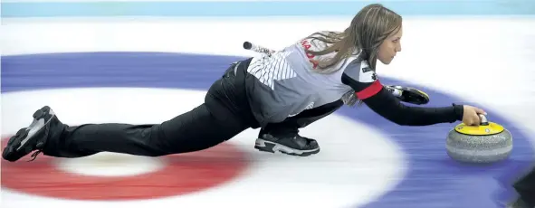  ?? MARK SCHIEFELBE­IN/AP ?? Canada’s Rachel Homan prepares to release the stone during a match against Italy Thursday at the CPT World Women’s Curling Championsh­ip in Beijing