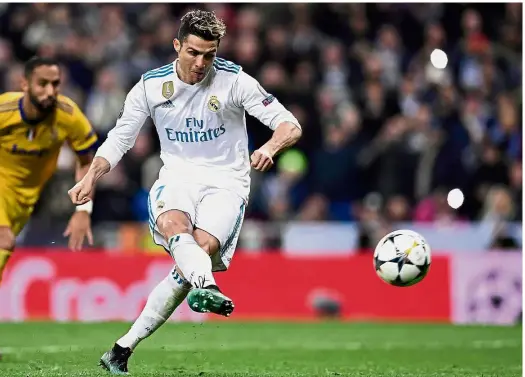  ?? — AFP ?? Masterclas­s: Real Madrid forward Cristiano Ronaldo scoring a penalty against Juventus during the Champions League quarterfin­al second-leg match at the Bernabeu on Wednesday