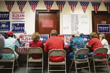  ?? Tom Reel / San Antonio Express-News ?? Volunteers stay busy making phone calls and organizing campaign material for candidates at the Bexar County Republican headquarte­rs last week.