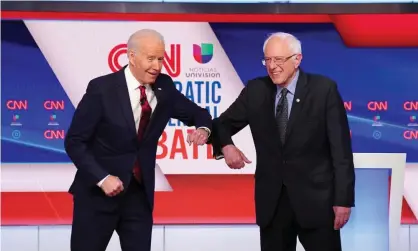  ??  ?? Democratic presidenti­al candidates Senator Bernie Sanders and former vice-president Joe Biden at the 11th Democratic candidates debate in Washington DC. Photograph: Kevin Lamarque/Reuters