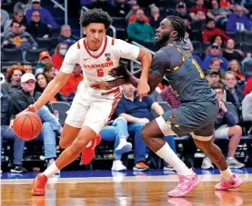  ?? ALEX BRANDON/ASSOCIATED PRESS FILE PHOTO ?? Clemson forward Jack Clark, left, drives around Boston College guard Prince Aligbe during an Atlantic Coast Conference game March 13 in Washington. Clemson has joined Florida State in a lawsuit over fees to leave the ACC.