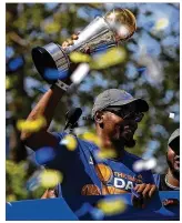  ?? JUSTIN SULLIVAN / GETTY IMAGES ?? Warriors forward Kevin Durant greets the crowd during Golden State’s victory parade Thursday in Oakland.