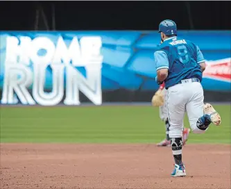  ?? JON BLACKER THE CANADIAN PRESS ?? Blue Jays’ Kendrys Morales rounds the bases after hitting a team record-breaking two-run home run against the Philadelph­ia Phillies during the third inning of an interleagu­e baseball game Sunday in Toronto.