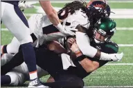  ?? Elsa / Getty Images ?? The Broncos’ A.J. Johnson sacks the Jets’ Sam Darnold during Thursday’s game.