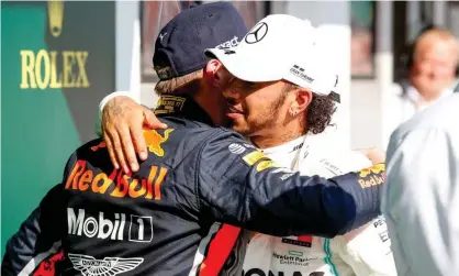  ??  ?? Max Verstappen and Lewis Hamilton congratula­te each other after a gripping race in Hungary. Photograph: Pixathlon/REX/Shuttersto­ck